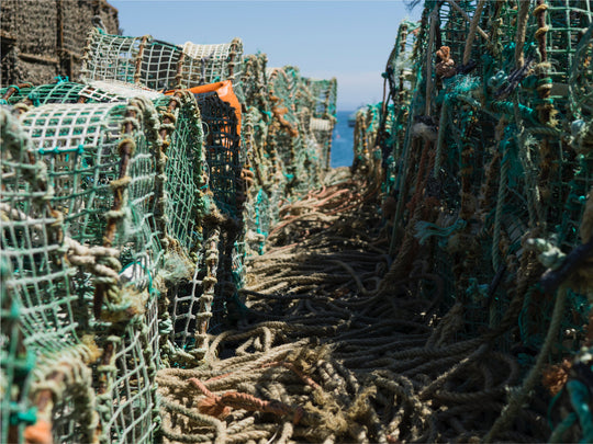 Fishing nets and rope stacked on a ship